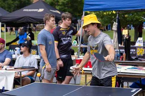 ksu club sport memebers playing table tennis\